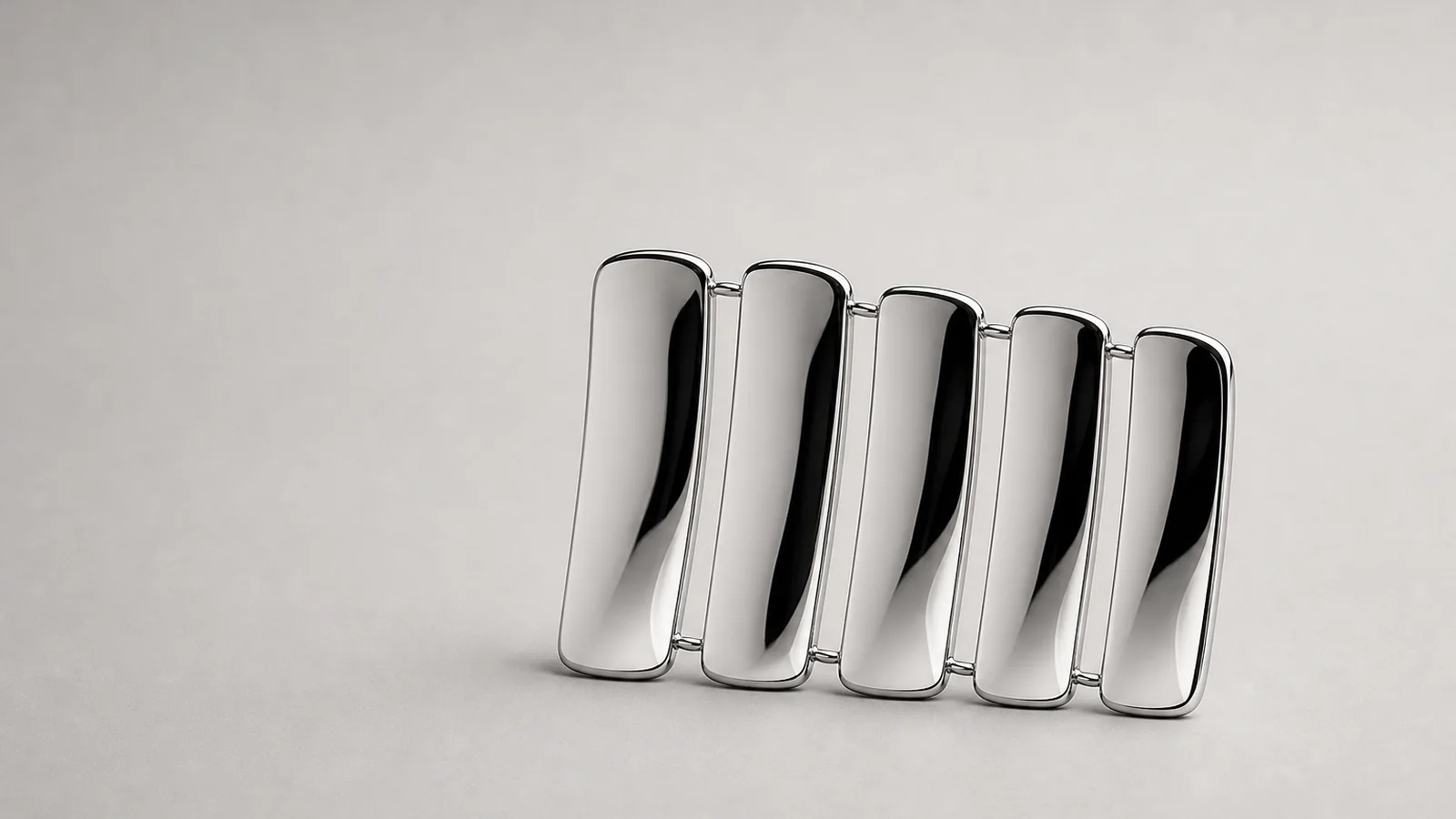 Five separate tiles linked by thin threads into a single silhouette
